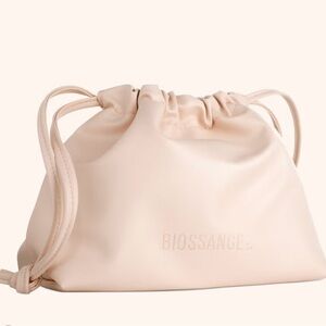 Biossance Drawstring Cosmetic Bag with Dry Brush, Straw Set, and Hat